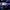 OpenAI Five competitive event in a large, dim venue with bright spotlights and a large audience